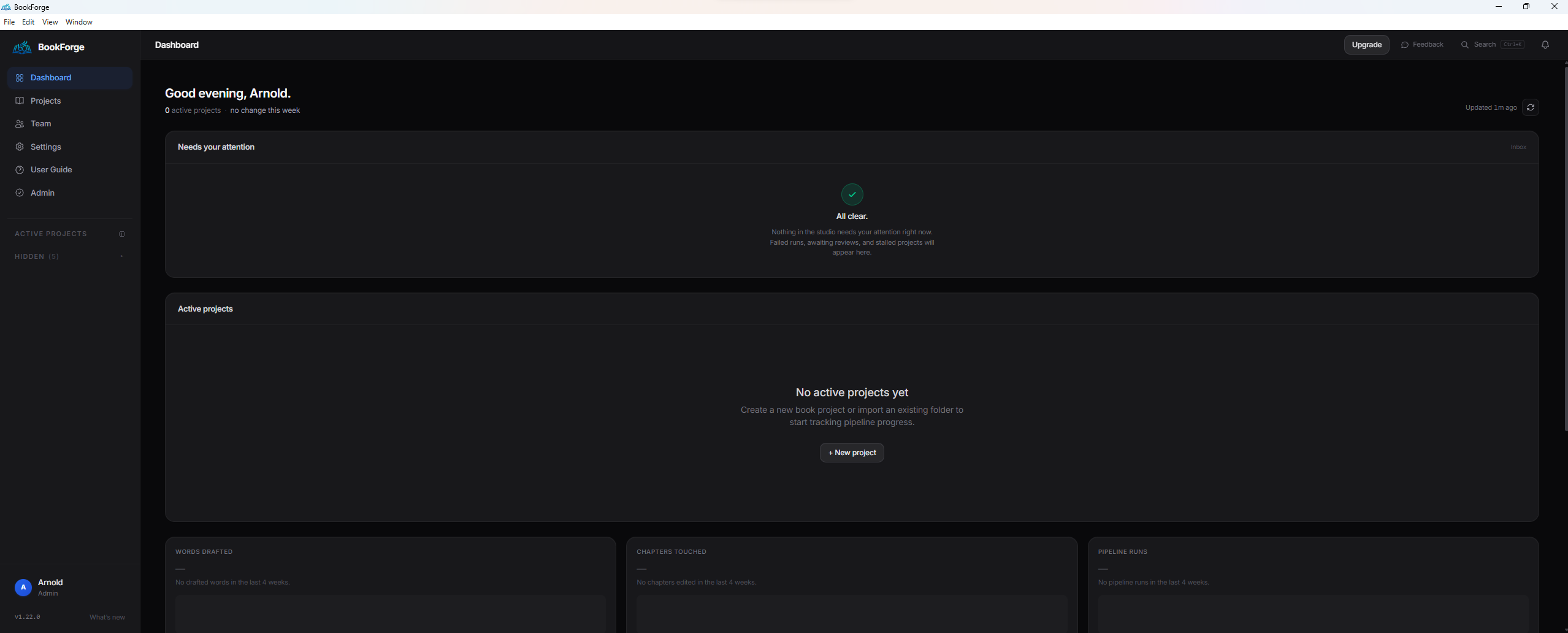 BookForge desktop app dashboard — sidebar with Dashboard / Projects / Team / Settings / User Guide / Admin navigation, a 'Good evening, Arnold' greeting, an empty 'Needs your attention' inbox, an 'Active projects' empty state, and Words drafted / Chapters touched / Pipeline runs metric panels.